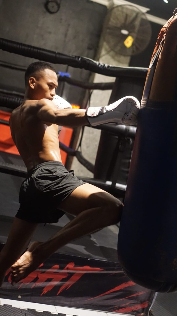 Coach Jerry training on the heavy bag